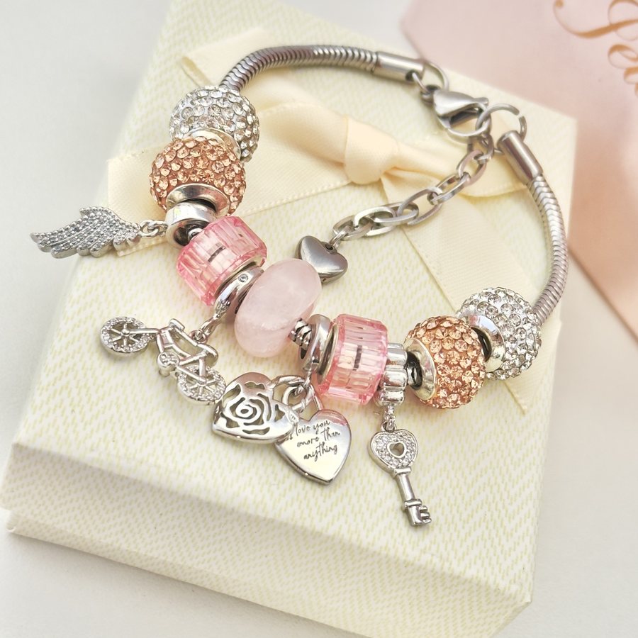 Pulsera Alas de Amor: ala, llave y un corazón que dice “i love you”