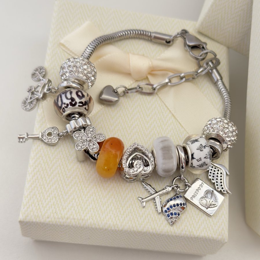 Pulsera Ámbar Libre: ámbar, mariposas, bici y pasaporte