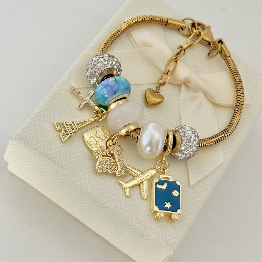 Pulsera Azul Viaje: perla, cuenta marina y charms para tu próximo destino